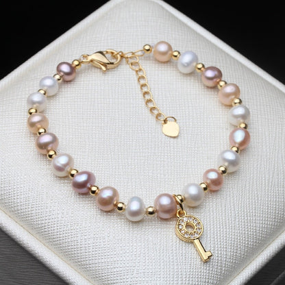 Echtes rosa, violettes und weißes Süßwasserperlen-Schlüsselarmband in Gold