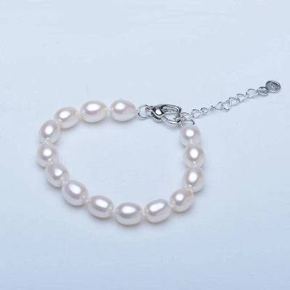 Conjunto de aretes, collar y pulsera de perlas genuinas de agua dulce